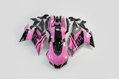 Pink and black motorcycle body parts on a white background