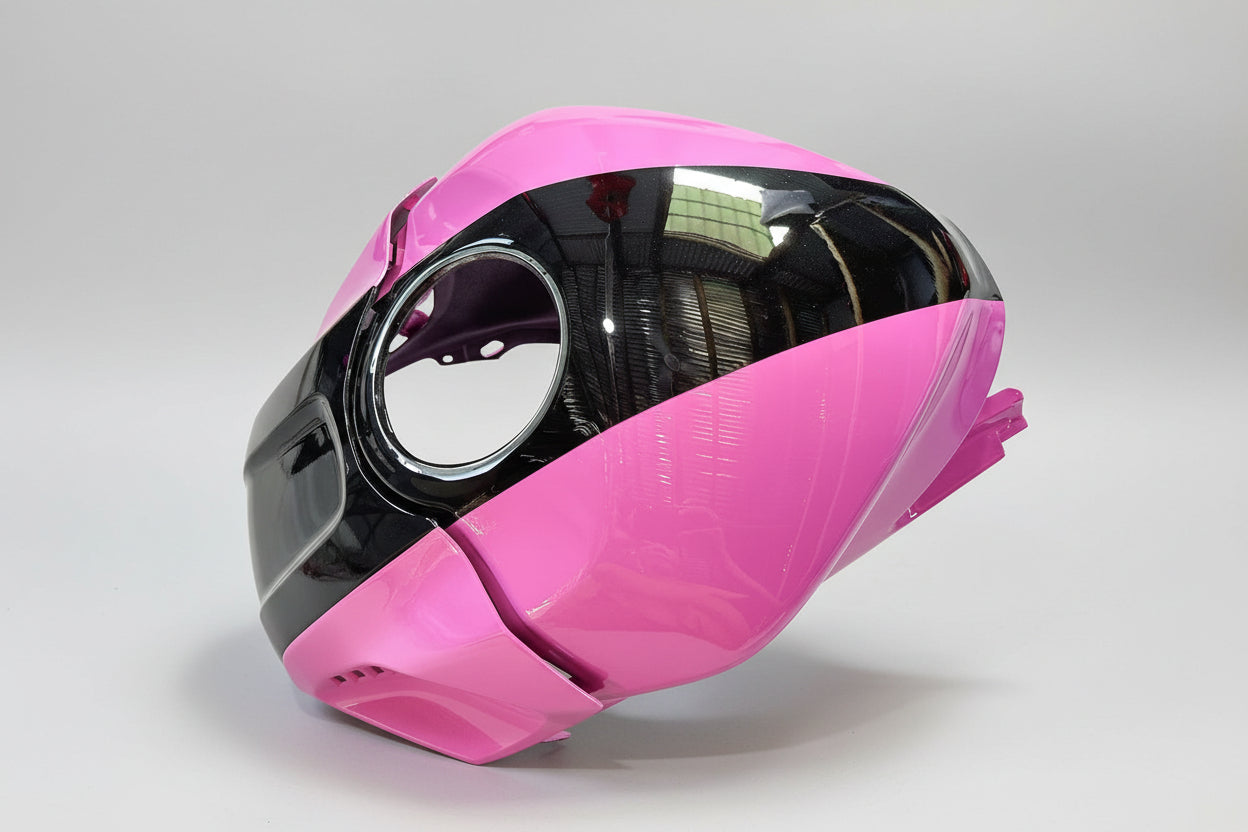 Pink and black helmet on a white background
