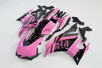 Pink and black motorcycle body parts on a white background