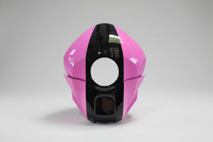 Pink and black motorcycle helmet on a white background