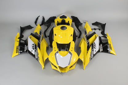 Yellow and black motorcycle bodywork pieces on a white background