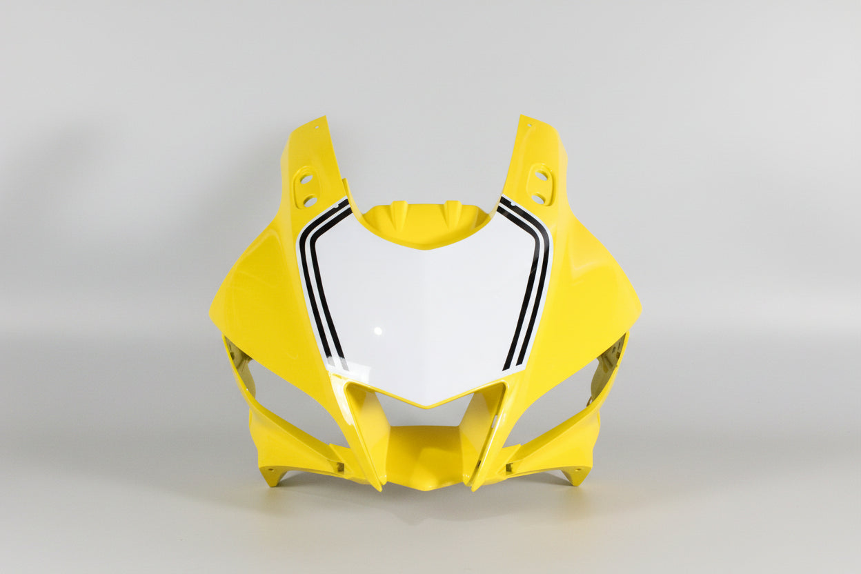 Yellow motorcycle fairing with white center and black accents on a white background