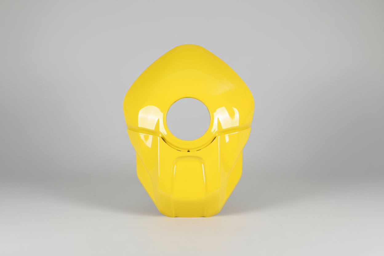 Yellow plastic cover with a circular cutout on a white background