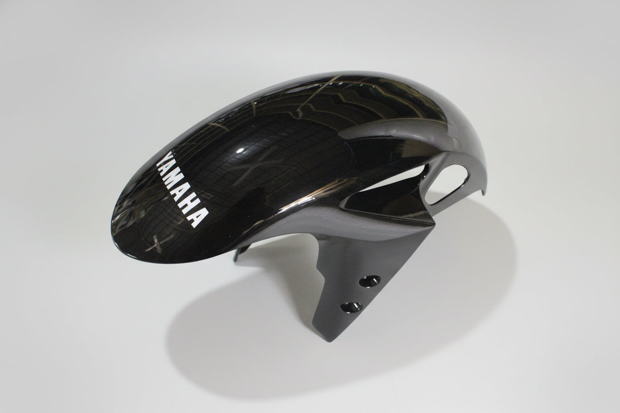 Black and gray motorcycle fender with Yamaha branding on a white background