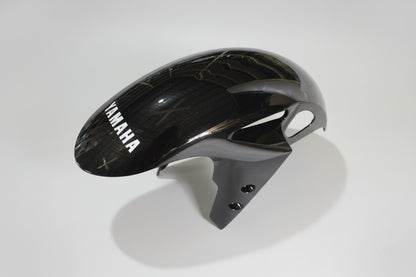 Black and gray motorcycle fender with Yamaha branding on a white background