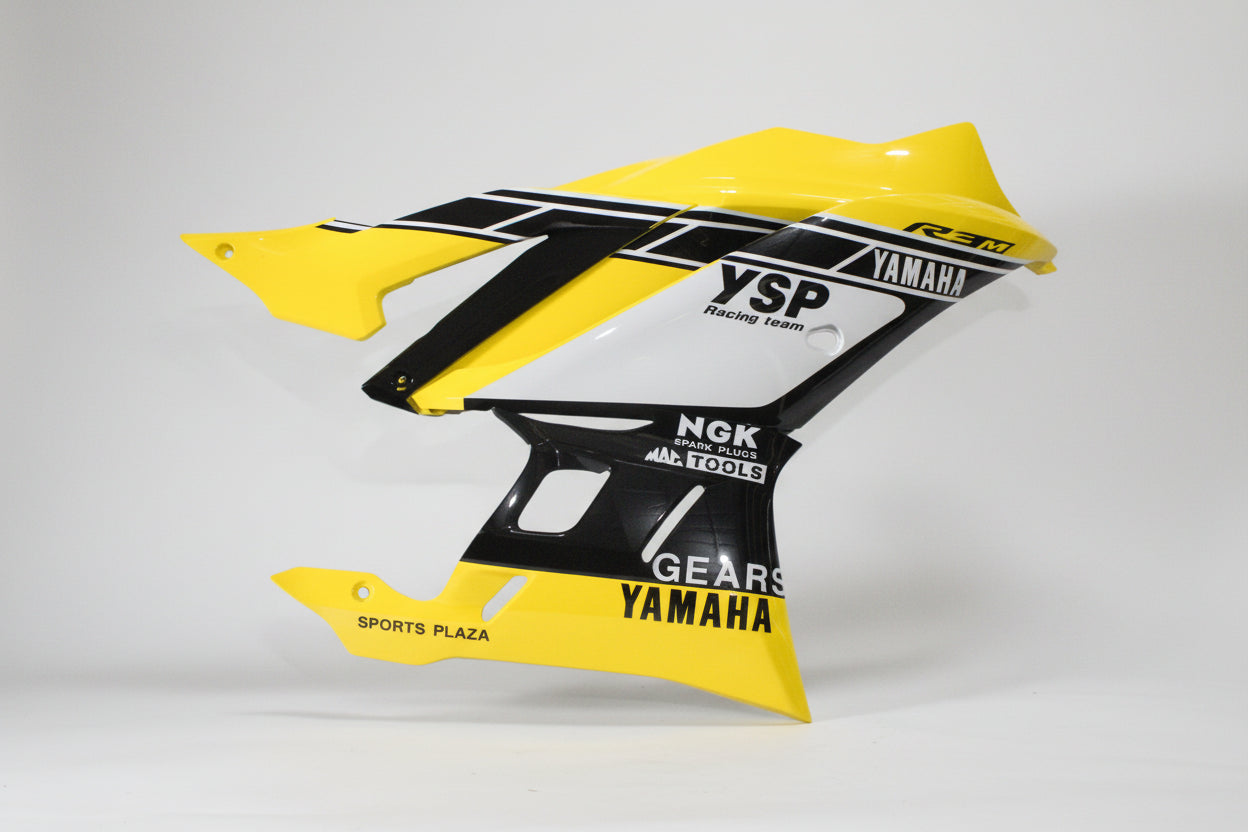 Yellow and black motorcycle fender with branding on a white background