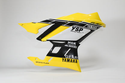 Yellow and black motorcycle fender with branding on a white background