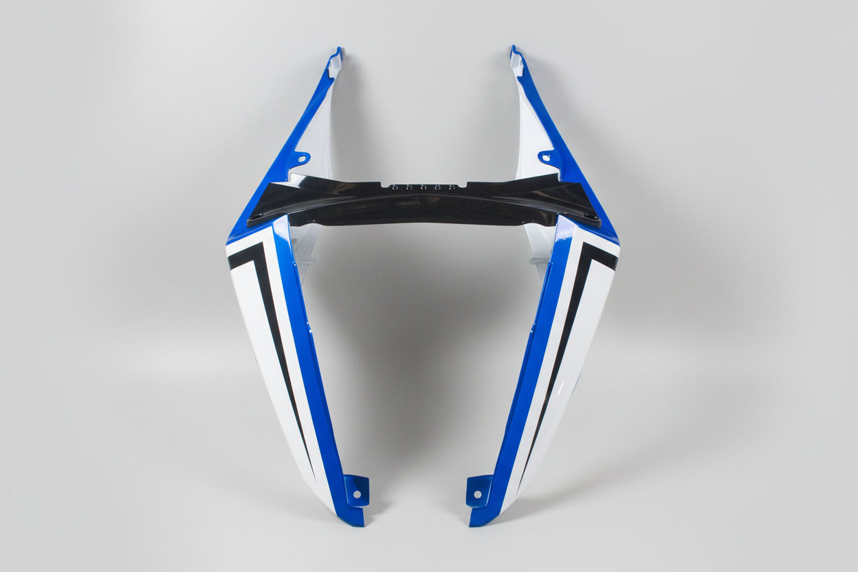 Motorcycle fairing with blue and white design on a white background