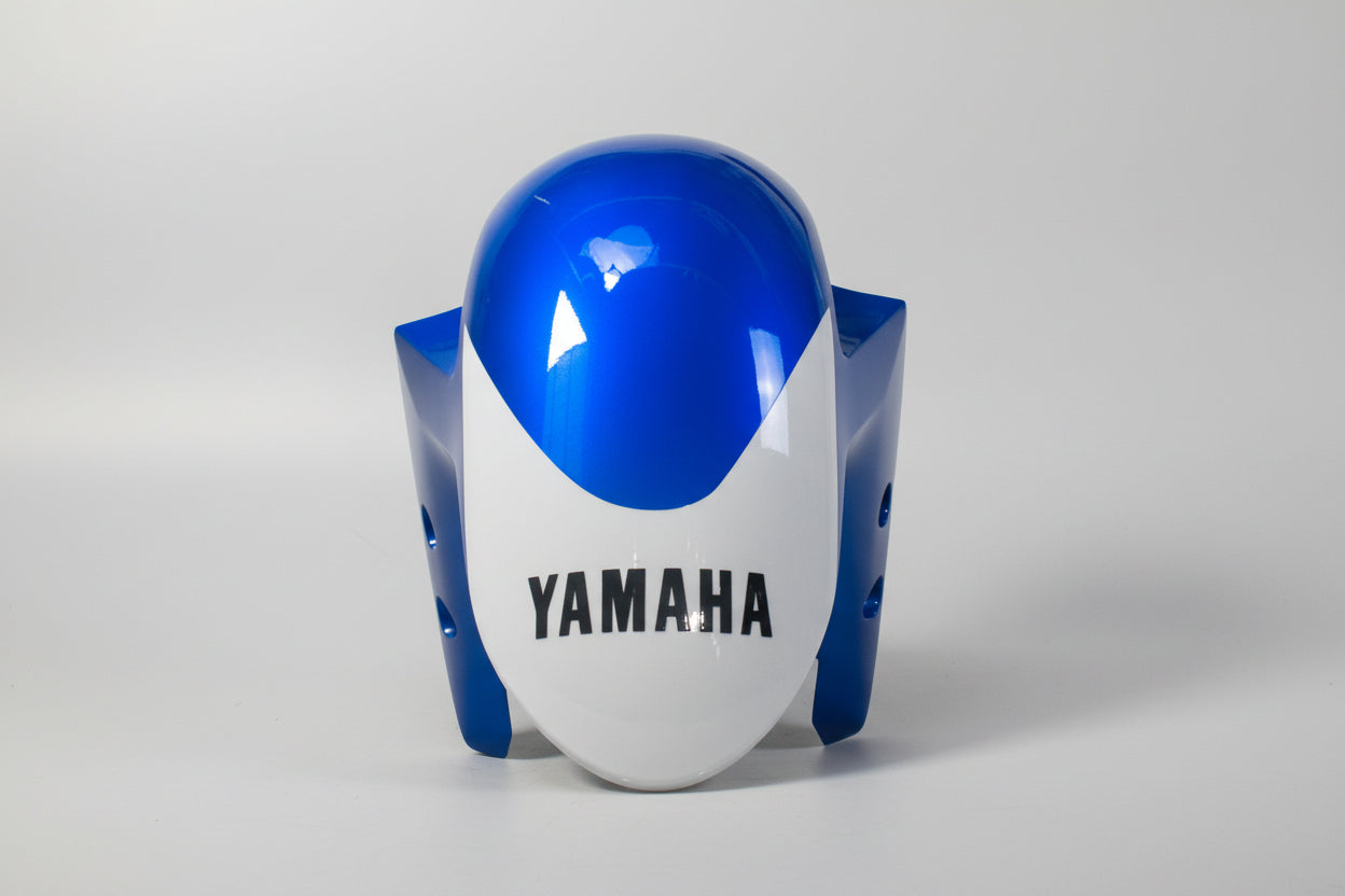 Blue and white motorcycle fairing with Yamaha logo on a white background