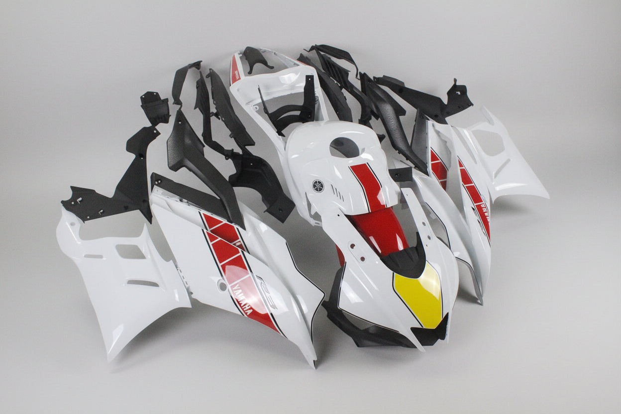 Motorcycle fairings in black, white, and red on a white background
