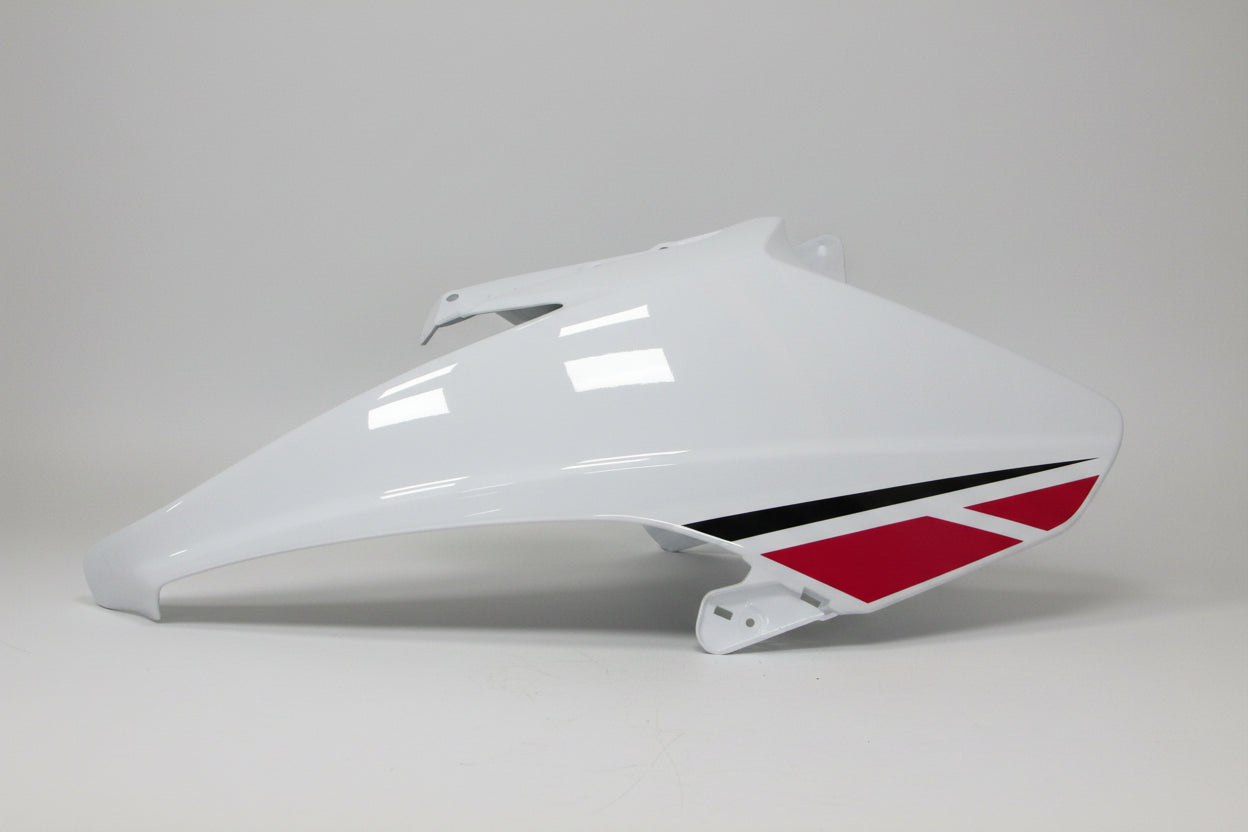 White motorcycle fairing with red and black design on a white background