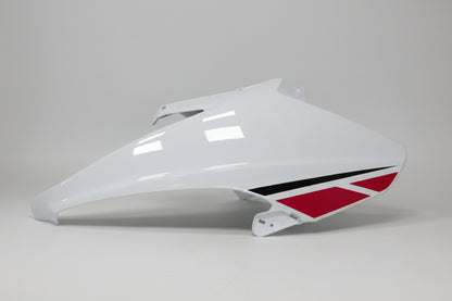 White motorcycle fairing with red and black design on a white background