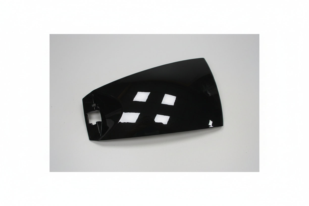 Black car fender with white labels on a white background