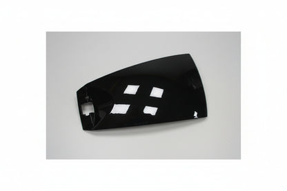 Black car fender with white labels on a white background