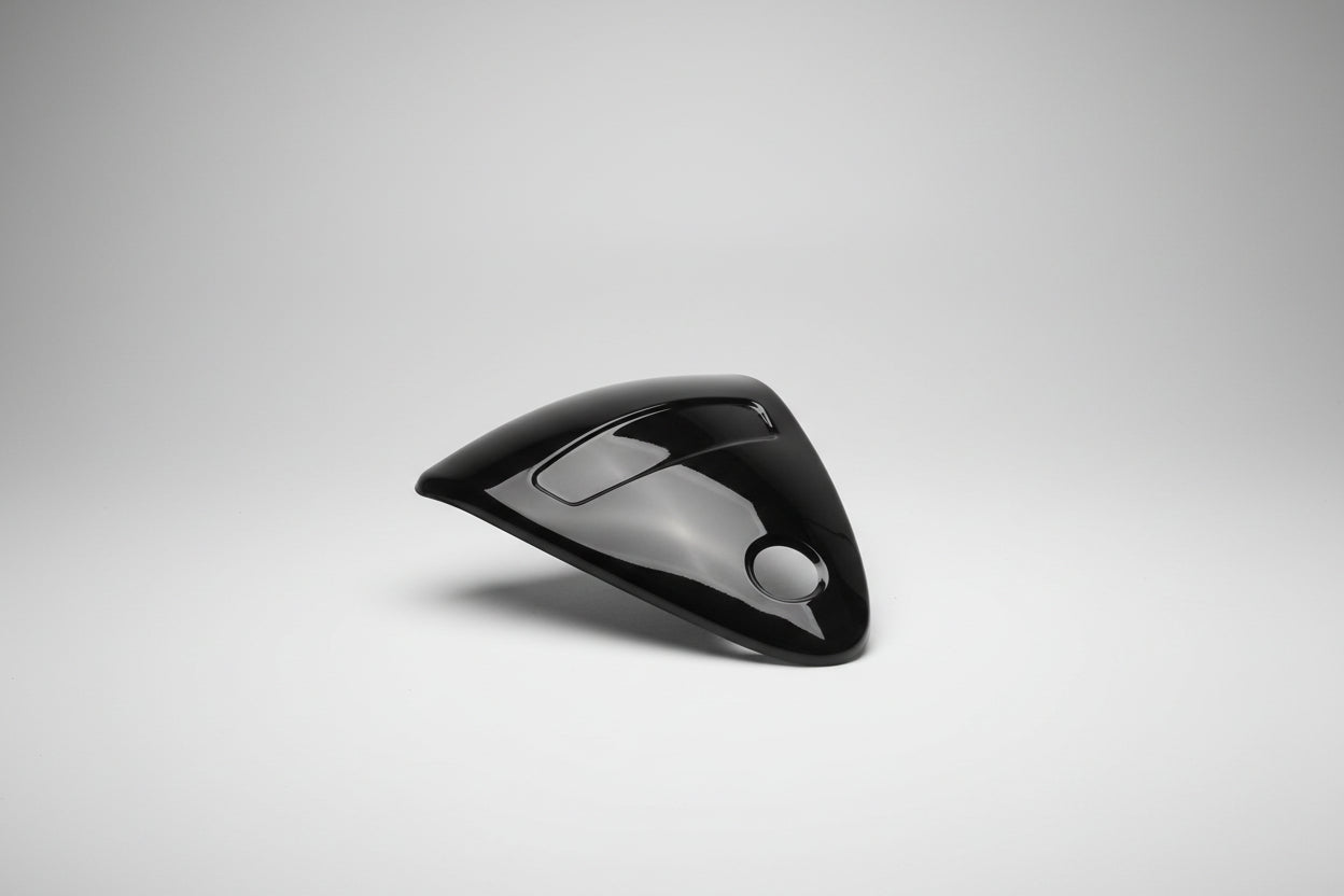Black triangular car mirror cover on a white background